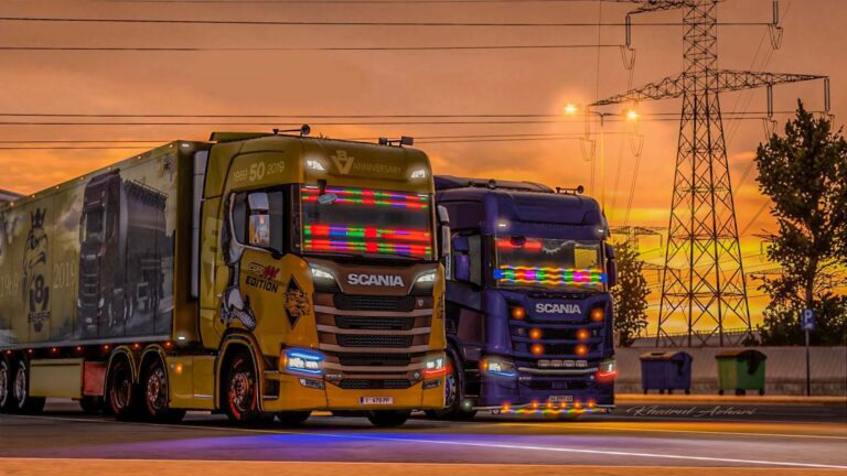 Deux camions Scania au coucher du soleil.